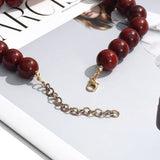 Colar Choker – Flor Grande, Contas de Resina Douradas,